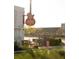 Exterior shot of sushi restaurant sign of a guitar, and outdoor seating at 2380 Edgar Park Pl # 101, Duluth, GA 30096