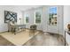Bright office space features wood-look flooring, a large window with natural light, and neutral decor at 2380 Edgar Park Pl # 101, Duluth, GA 30096