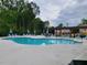 Resort-style pool with comfortable lounge chairs and pergola for shade at 2380 Edgar Park Pl # 101, Duluth, GA 30096