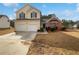 Charming two-story home with a two car garage and well-maintained front yard at 2928 Lakewater Way, Snellville, GA 30039