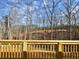 View from a wood deck overlooking trees and a distant construction site in the background at 3382 Milan Ct, Douglasville, GA 30135