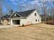 Side view of a single-story residence with a spacious attached garage and well-maintained lawn at 3382 Milan Ct, Douglasville, GA 30135
