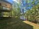 Scenic backyard with a wooden deck overlooking a peaceful, wooded area and waterway at 3687 Thornhill Ct, Douglasville, GA 30135