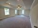 Spacious bedroom with tray ceilings, recessed lighting, and plush carpeting at 3687 Thornhill Ct, Douglasville, GA 30135