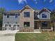 Charming two-story home with a stone and gray brick facade and a two-car garage at 3687 Thornhill Ct, Douglasville, GA 30135