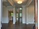 Inviting foyer with dark hardwood floors leading to a bright and airy living space at 3687 Thornhill Ct, Douglasville, GA 30135