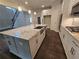 Spacious kitchen featuring an island with a sink, stainless steel appliances, and white cabinets at 3687 Thornhill Ct, Douglasville, GA 30135