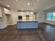 Open-concept kitchen with a large island, modern appliances, and ample cabinet space at 3687 Thornhill Ct, Douglasville, GA 30135