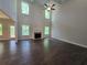 Bright living room boasting soaring ceilings, a fireplace, and gleaming hardwood floors at 3687 Thornhill Ct, Douglasville, GA 30135