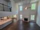 Bright living room with fireplace, tall ceilings, hardwood floors and large windows at 3687 Thornhill Ct, Douglasville, GA 30135