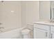 Bright bathroom with white tile, a shower-tub combo, and a modern vanity at 4360 Sims Park Overlook, Suwanee, GA 30024