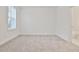 Spacious, carpeted bedroom with large windows and an ensuite bathroom at 4360 Sims Park Overlook, Suwanee, GA 30024