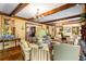 Spacious living room featuring hardwood floors, beamed ceilings, and natural light at 8185 Habersham Waters Rd, Atlanta, GA 30350