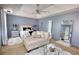 Bright bedroom with tray ceilings, accent lighting, and a full-length mirror at 120 Sunflower Ln, Covington, GA 30016