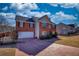 Attractive two-story red brick home with an attached double garage and professionally landscaped front yard at 120 Sunflower Ln, Covington, GA 30016