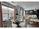 The dining area features a glass table and a glimpse into the adjacent living room at 120 Sunflower Ln, Covington, GA 30016