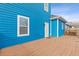 View of the backyard featuring a wooden deck and blue siding at 1598 Jonesboro Se Rd, Atlanta, GA 30315