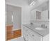 Bright bathroom features double vanity, granite countertops, and white cabinetry at 1598 Jonesboro Se Rd, Atlanta, GA 30315