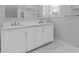 Elegant bathroom with dual sinks, marble countertop and updated fixtures at 1598 Jonesboro Se Rd, Atlanta, GA 30315