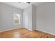 Neutral bedroom with hardwood floors, closet, and bright window at 1598 Jonesboro Se Rd, Atlanta, GA 30315