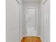 Hallway showing bathroom with marble tile, and white closets at 1598 Jonesboro Se Rd, Atlanta, GA 30315