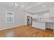 Bright, modern kitchen featuring white cabinets, stainless steel appliances, and breakfast bar seating at 1598 Jonesboro Se Rd, Atlanta, GA 30315
