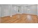 View of the open living room with hardwood floors and white trim throughout the home at 1598 Jonesboro Se Rd, Atlanta, GA 30315