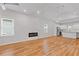Spacious living room with hardwood floors, vaulted ceilings, a modern fireplace, and lots of light at 1598 Jonesboro Se Rd, Atlanta, GA 30315