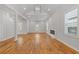 Spacious living room with hardwood floors, recessed lighting, and a modern fireplace at 1598 Jonesboro Se Rd, Atlanta, GA 30315