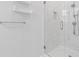 Modern shower with glass door and marble-look tile at 1598 Jonesboro Se Rd, Atlanta, GA 30315