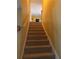 Carpeted stairway leads to the upper level of this home at 942 Thorny Lane, Grayson, GA 30017