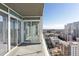 This balcony has sliding glass doors and overlooks the city streets at 3325 Piedmont Ne Rd # 1502, Atlanta, GA 30326