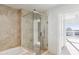 Modern bathroom boasts glass shower, tile surround, and natural light at 3325 Piedmont Ne Rd # 1502, Atlanta, GA 30326