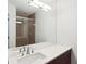 Bathroom featuring a glass shower, modern fixtures, and a white countertop at 3325 Piedmont Ne Rd # 1502, Atlanta, GA 30326