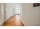Hallway with wood flooring, white doors, and a sign that says 'Massage Treatment' at 3325 Piedmont Ne Rd # 1502, Atlanta, GA 30326
