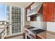 Gourmet kitchen featuring stainless steel appliances, granite countertops, and city views at 3325 Piedmont Ne Rd # 1502, Atlanta, GA 30326