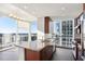 Spacious open kitchen with granite countertops, stainless steel appliances, and beautiful city views at 3325 Piedmont Ne Rd # 1502, Atlanta, GA 30326