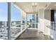 Bright living room featuring walls of windows and hardwood floors at 3325 Piedmont Ne Rd # 1502, Atlanta, GA 30326