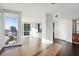 Bright living room with hardwood floors, floor-to-ceiling windows, city views, and open access to kitchen at 3325 Piedmont Ne Rd # 1502, Atlanta, GA 30326
