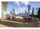 Spacious rooftop deck with dining area and amazing city views at 3325 Piedmont Ne Rd # 1502, Atlanta, GA 30326