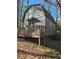 Quaint two-story home with a gable roof, front porch, and wood trim at 362 Old Ivy Ne Rd, Atlanta, GA 30342