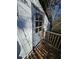 Exterior door with a glass window and a small wooden deck, surrounded by foliage at 362 Old Ivy Ne Rd, Atlanta, GA 30342