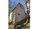 Cozy two-story home with a gable roof and lattice foundation, nestled among trees at 362 Old Ivy Ne Rd, Atlanta, GA 30342