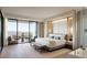 A luxurious bedroom featuring a balcony with views, modern decor, a sitting area, and an adjoining bathroom at 362 Old Ivy Ne Rd, Atlanta, GA 30342