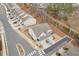 An aerial view of a residential street showing the house with a driveway and sidewalk at 539 Walton Dr, Woodstock, GA 30188