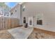 View of the backyard featuring a small concrete patio and a fenced-in area, perfect for outdoor relaxation at 539 Walton Dr, Woodstock, GA 30188