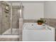 Bathroom features a soaking tub, a glass enclosed shower and neutral tile at 539 Walton Dr, Woodstock, GA 30188