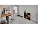 Office featuring a desk, computer, printer, ergonomic chair, and shelving unit at 539 Walton Dr, Woodstock, GA 30188