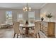 Dining room with a wooden table and upholstered chairs at 539 Walton Dr, Woodstock, GA 30188