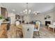 Open-concept dining room with hardwood floors and views of the kitchen and living room at 539 Walton Dr, Woodstock, GA 30188